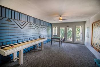 A living room with a bench and a table